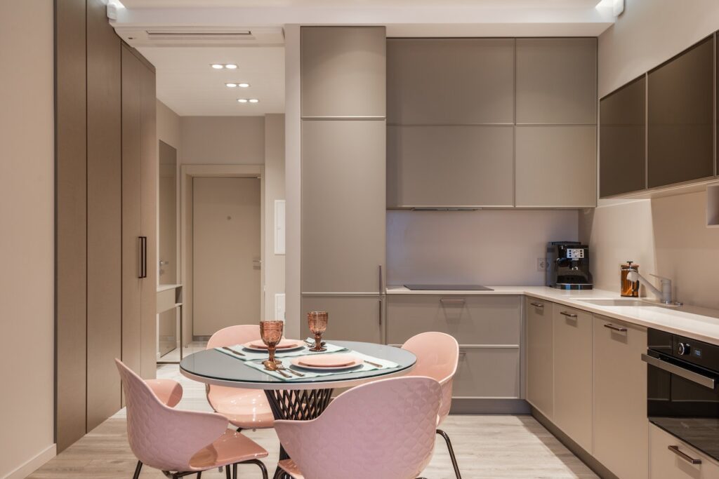Image shows contemporary kitchen interior with dining zone